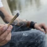 Man holding a marijuana joint