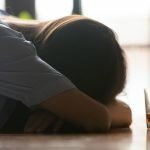 Woman at bar with signs of alcohol poisoning