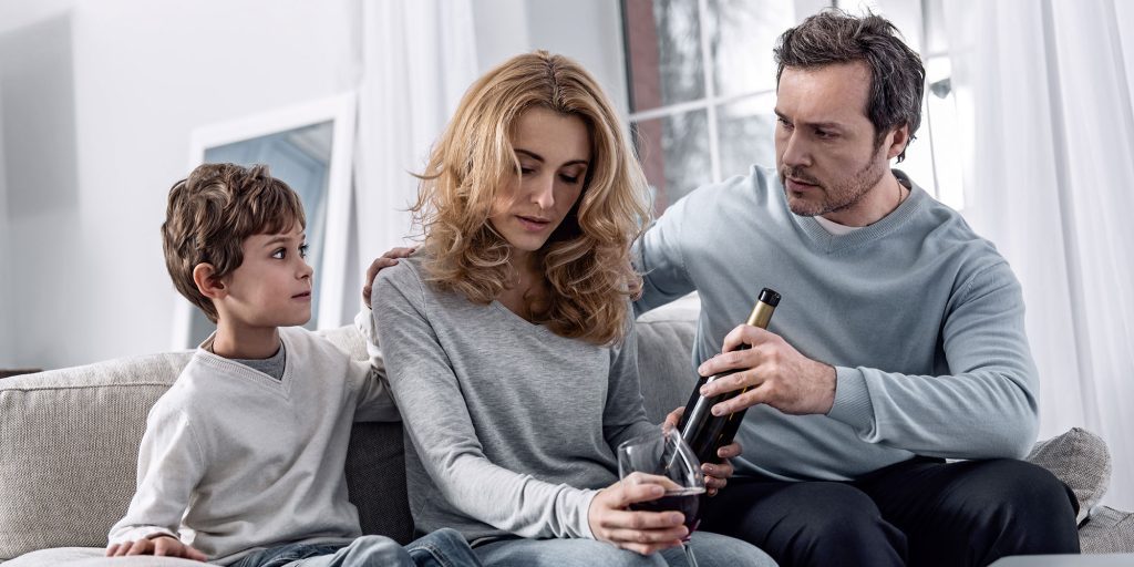 Father and son try to take alcohol away from mother who is an addict