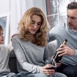 Father and son try to take alcohol away from mother who is an addict