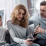 Father and son try to take alcohol away from mother who is an addict