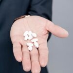 Business professional with addictive nootropics in hand